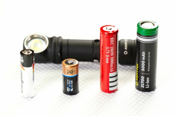 Armytek Wizard C2 Pro Max Magnet USB flashlight A standard AA for comparison then, left to right, a classic lithium CR123 a 18650 and the 21700 used in the Wizard C2 Pro Max