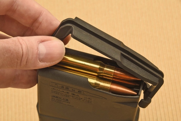 The protection cover of a 7.62x51mm NATO magazine, opened