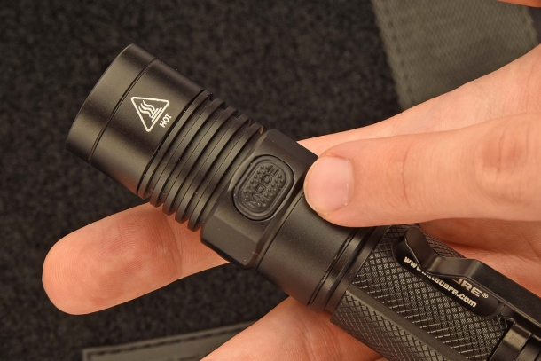The Mode switch button on the flashlight head