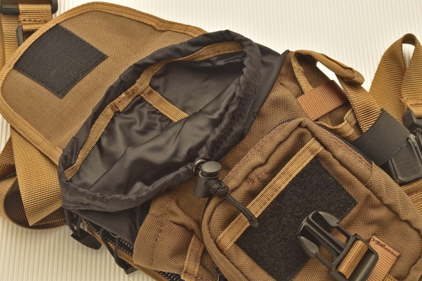 The elastic strap that secures the main compartment