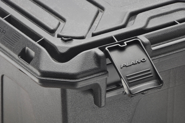 Two side latches lock the top hinged cover