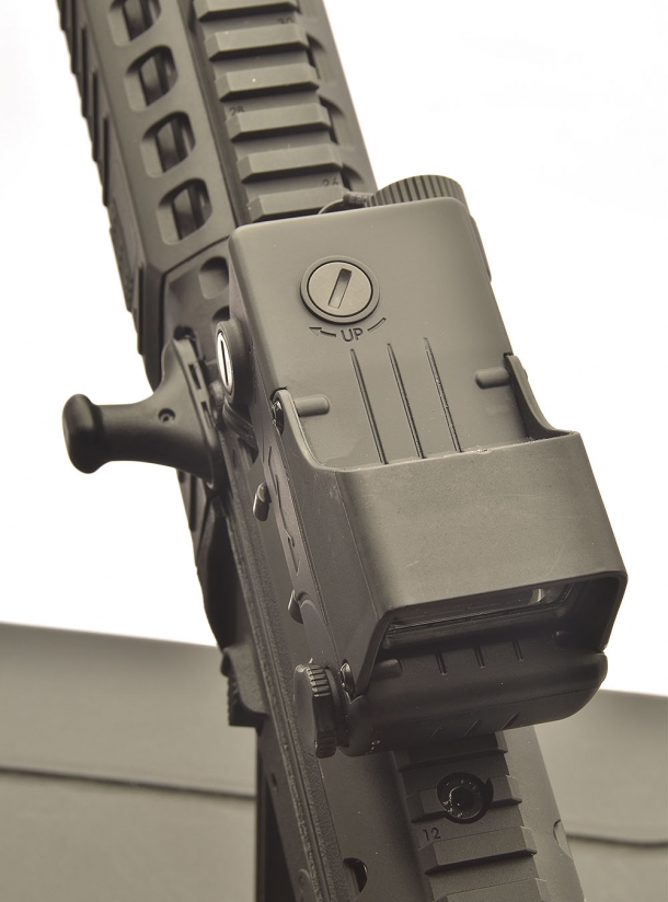 In front, there are the two screw regulating the red dot alignment
