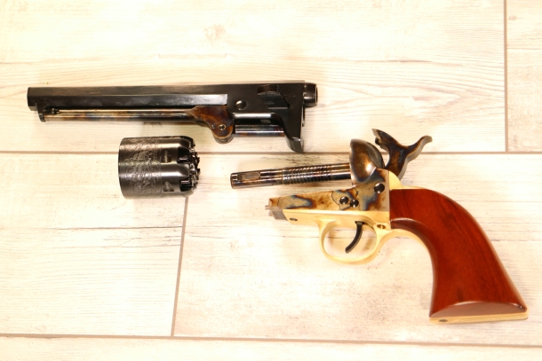 To swap the cylinder on a Navy one needs to disassembly the gun and juggle barrel, frame, the empty cylinder and the loaded one. Now imagine doing it on a skittish horse on a battlefield.