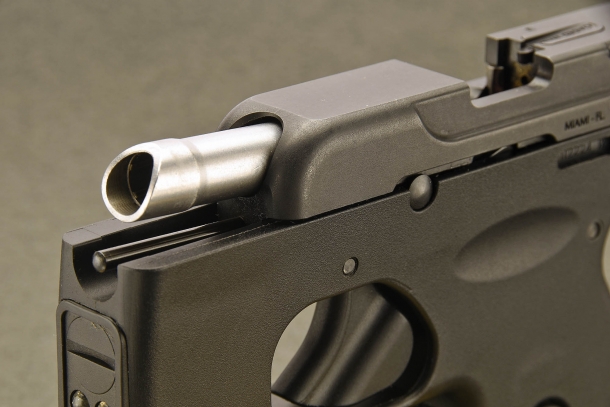 A close-up of the slant muzzle of the Taurus 180 Curve pistol