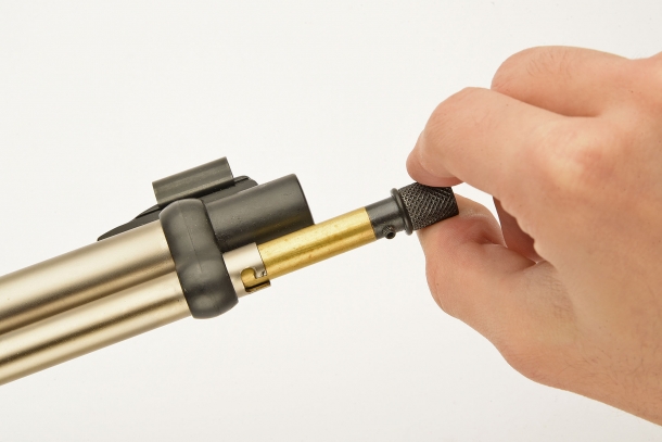 Rotate the magazine front cap, unlock the follower and extract it from the magazine tube