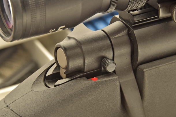 The manual safety: striker is armed, safety is disengaged