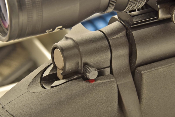 The manual safety: striker is armed, safety is engaged