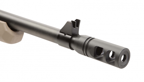 Savage Arms 110 Scout bolt action rifle A close-up of the protected, fixed front blade sight; the flash hider is removable from the 5/8x24" threaded muzzle, making the Savage 110 Scout suppressor-ready