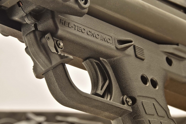 A close-up of the trigger area of the KSG; the lever in front of the trigger guard is the disconnector