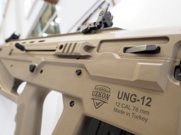 The bolt release latch is located on the left side, opposite to the ejection port