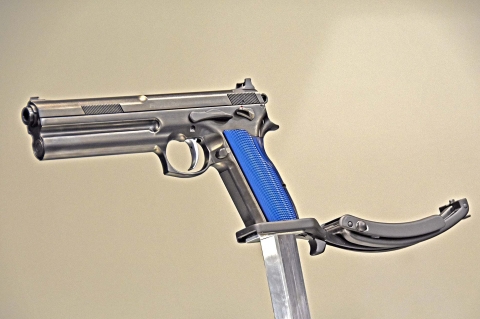 The pistol with the flat back grip design and the new removable folding stock (folded)